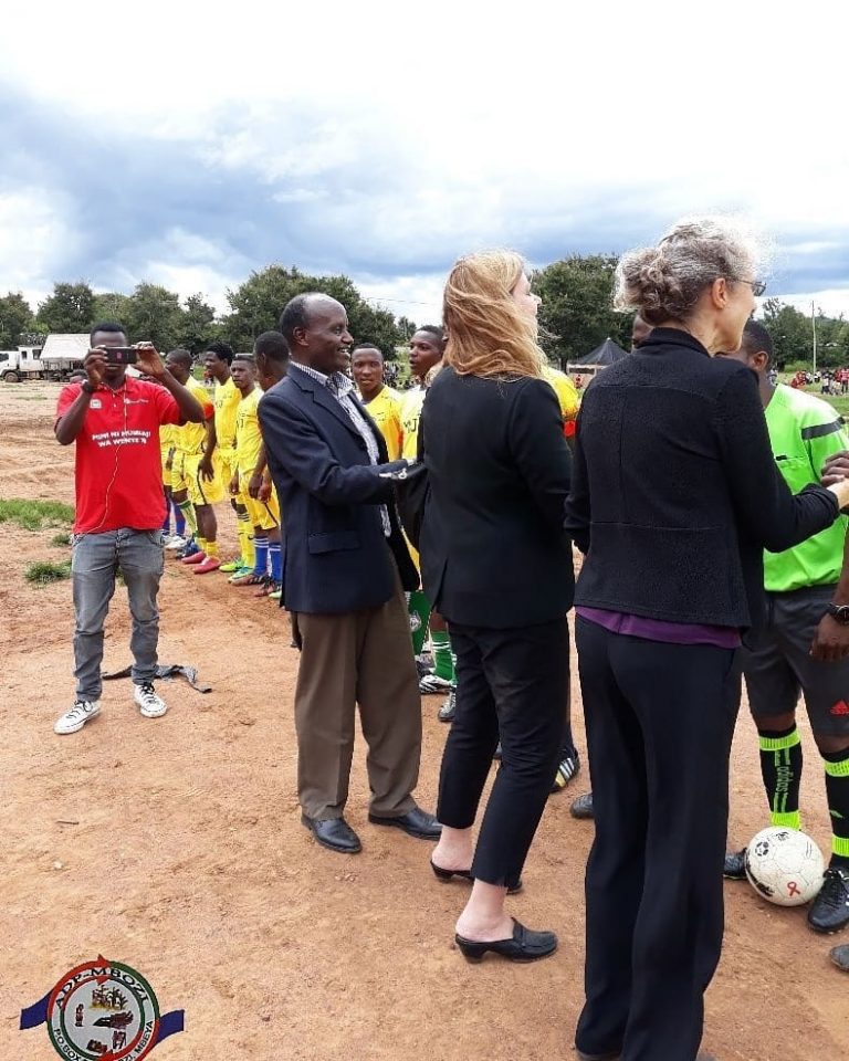 Read more about the article HJFMRI visitors and ADP Mbozi Executive Director greeting footballers before the kickoff.